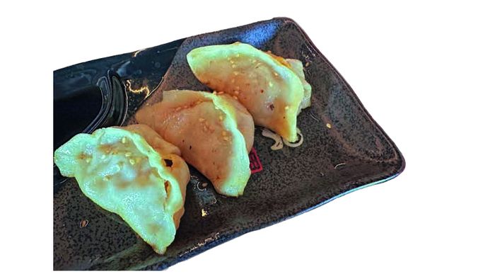Dish on a dark plate at A Niu