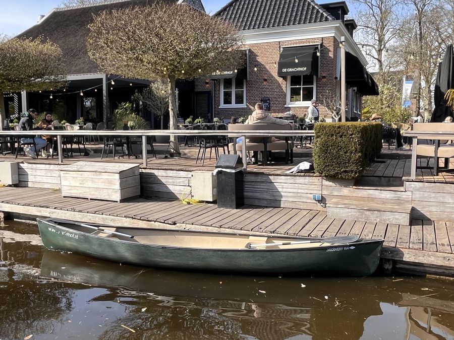 Canadian canoe at the jetty in front of the De Grachthof terrace