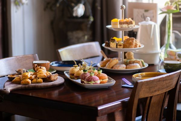 Table with a high tea in the restaurant of De Rietstulp