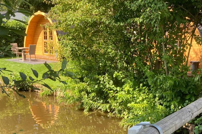 Wooden camping pod with veranda at Camping D'Hof