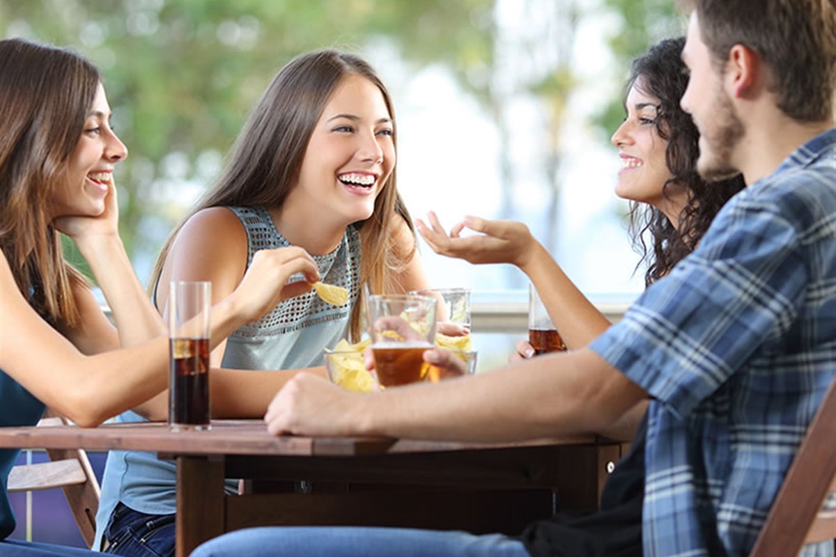 Visitors enjoying food and drink on a terrace in Giethoorn