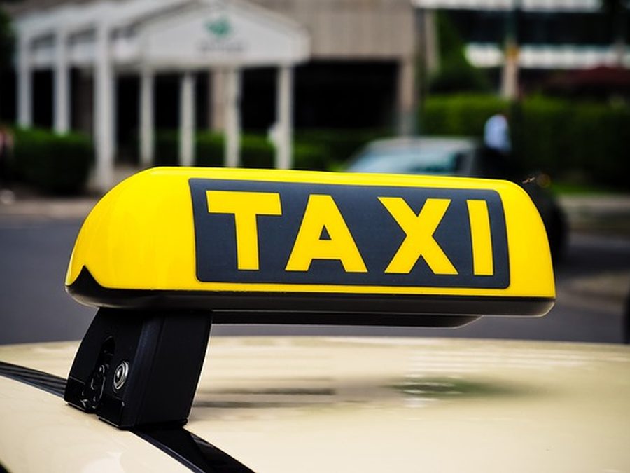 Taxi sign on the roof of a taxi
